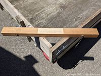 Wooden carrying case with label showing product details.