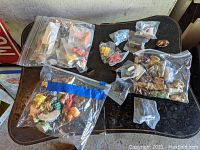 Various Wade Porcelain Red Rose Tea figurines bagged in plastic, assorted sizes and colors