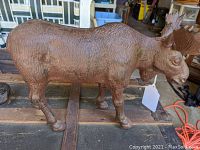 Side view of the cast iron moose doorstop showing textured fur details and sturdy legs.