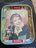 Full view of the 1953 Coca Cola advertising tray with colorful branding and a woman holding a Coke bottle.