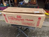 Original cardboard shipping box labeled “2 illuminated Contemporary Classic off premise cold beer signs,” marked fragile.