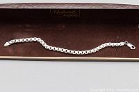 Full view of the 925 silver box chain bracelet laid out in a brown velvet-lined box showing the entire length and clasp.