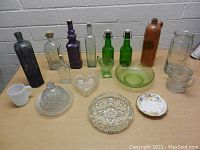 Photo of assorted glass bottles and dishes on a table