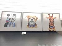 Three animal-themed kids art canvases including panda, bulldog and giraffe on 16x16 inch canvases