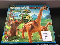 Original packaging box showing playmobil dinos set number 5231 with large dinosaur and prehistoric environment printed on box.