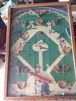 Overhead view of the baseball pinball game showing layout and graphics.