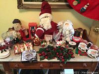 Overview of assorted Christmas decorations spread on table