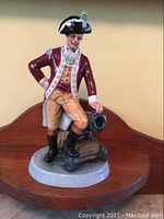 Front view showing officer pose and cannon detail