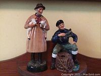 Photo showing both figurines together from front view, placement and scale