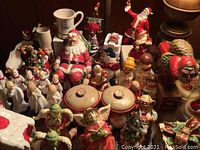 Overview of assorted Christmas figurines and decor on tabletop
