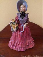 Front view of the Royal Doulton Lady Betty figurine showing detailed painting and posture.