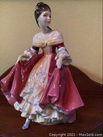 Front angle view of Royal Doulton Southern Belle figurine showing detailed dress and face
