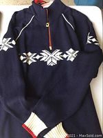Front view of navy half-zip sweater with white Nordic pattern