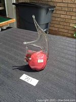 Red and clear Mtarfa blown glass fish viewed from front showing body and clear glass fin/tail details