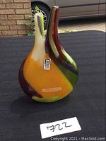 Front view of multicolour Mdina blown glass vase showing vibrant colors and dual openings