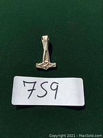 Front view of the sterling silver Thor's Hammer pendant showing textured and engraved patterns.