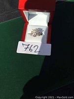 Photo of sterling silver Viking ring inside red jewelry box showing the intricate Viking design on the ring.