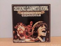 Front cover of Creedence Clearwater Revival 20 Greatest Hits double album, titled 'Chronicle', showing band members and album title.