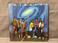 Front album cover showing the six Jackson brothers in futuristic outfits with a galactic background