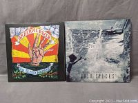 Front covers of Okkervil River 'The Stage Names' and Cold Specks 'Neuroplasticity' vinyl LP albums.