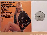 Front cover of Chuck Berry vinyl album 'Sweet Little Rock and Roller' showing woman in black studded jacket and track listing.