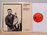 Front cover of vinyl LP featuring Freddie King holding a guitar.