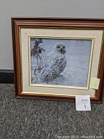 Front view showing framed print of snowy owl artwork