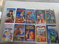 Photo of 10 Disney VHS tapes including Anastasia, Pinocchio, Toy Story, Beauty and the Beast, Peter Pan, Winnie the Pooh, Dinosaur, Lady and the Tramp, Sword in the Stone, Monsters Inc.
