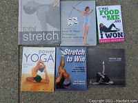 9 exercise and yoga books arranged on ground