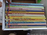 Spine view of 18 books showing titles including The Princess Who Never Laughed, Ali Baba and the 40 Thieves, Snow White and the Seven Dwarfs, The Sorcerer's Apprentice, Bambi and the Big Snow, and others.