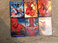 Six Spider-Man DVD and Blu-ray cases showing various movie editions.