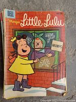 Full front cover of Marge's Little Lulu comic book featuring the story 'Mumps' showing cartoon characters playing tic-tac-toe and wearing mid-century clothing.