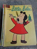 Cover photo of Marge's Little Lulu comic book showing Little Lulu holding medicine bottle and spoon.