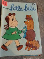 Front cover of 1951 Marge's Little Lulu comic book showing Little Lulu with a brown poodle holding a 1st place ribbon.