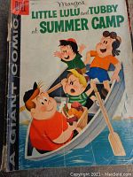 Cover of the 1958 Marge's Little Lulu and Tubby comic book 'Summer Camp' showing the characters in a canoe scene.