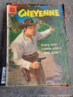Front cover of the 1958 Dell Cheyenne comic book showing a western lone gunman with a pistol.