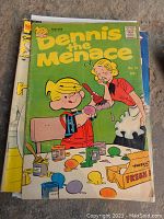 Front cover of Dennis the Menace comic book No. 51 with colorful art of Dennis painting Easter eggs and his mother supervising, visible wear on edges.
