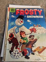 Front cover of 1957 Dell Frosty the Snowman comic book with colorful illustration of Frosty and children in snow.