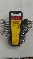 Photo showing 22 piece GreatNack combination wrench set in black plastic holder with yellow label, displaying SAE and metric sizes.