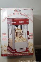 Box of Popflix Cinema-Style Kettle Popcorn Popper with promotional graphics and product information.