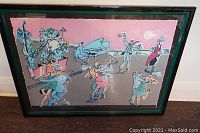 Framed print showing a dynamic ballroom scene with dancers and musicians in stylized art, primarily pink and blue hues.