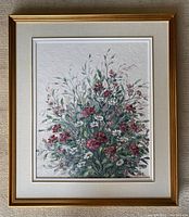 Full view of framed painting against textured wall