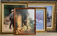 Four framed prints shown together: boy watching frog, boys by fireplace, hunting scene, river landscape.