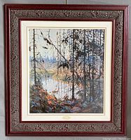 Full front view of framed print showing wooden carved frame and art