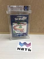 Front view of original sealed Activision Skiing game box for Atari 2600 in graded clear case with Wata A+ 8.0 label and Wata logo sticker in front.