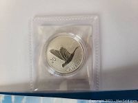 Close-up of the silver coin showing the flying Canada Goose design and denomination.