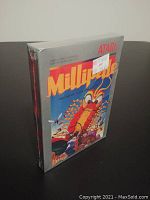 Front and side view of the factory sealed Millipede Atari 2600 video game cartridge box with original shrink wrap and price sticker.