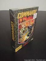 Side view showing sealed plastic wrap on the Commando Atari 2600 game box with soldier-themed artwork and highlighting brand and labels.