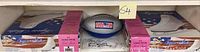 Figure skates in original boxes and autographed toy basketball in the middle