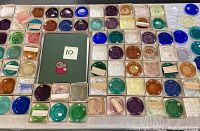 Overhead view of grouped cup plate boxes with reference catalogue at center